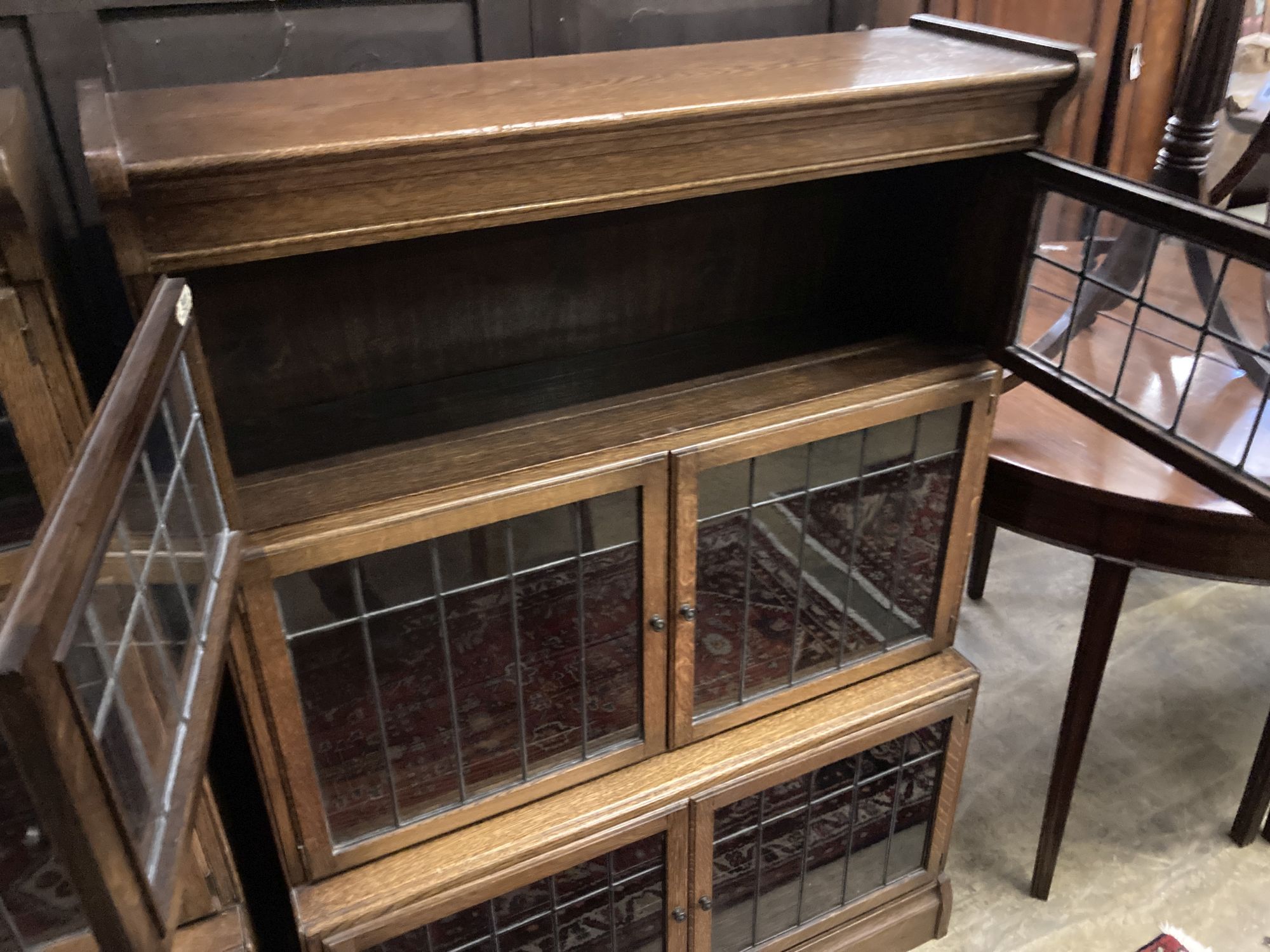 A pair of Globe Wernicke style oak three section leaded glazed bookcases, length 89cm, depth 33cm, height 129cm